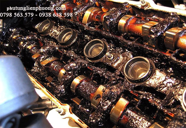 cặn bẩn từ dầu máy rất dễ gây ảnh hưởng cho tỳ xích cam xe ford escape cặn bẩn từ dầu máy rất dễ gây ảnh hưởng cho tỳ xích cam xe ford escape