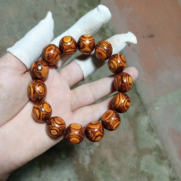 VÒNG TAY GỖ SƯA MẮT QUỶ 16MM X 14 HẠT HIẾM