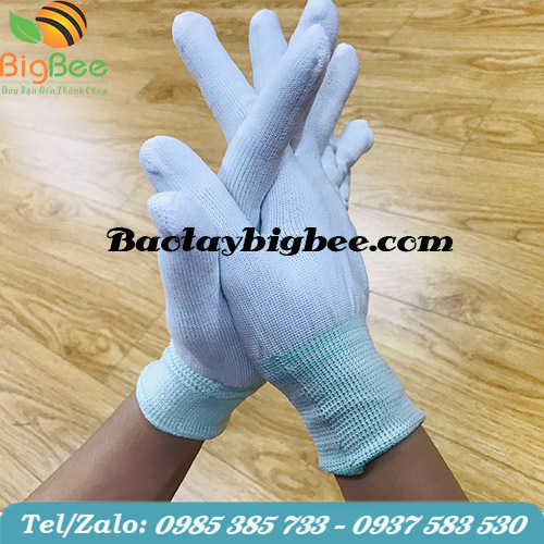 Găng tay vải thun màu trắng. Găng tay vải thun màu trắng.