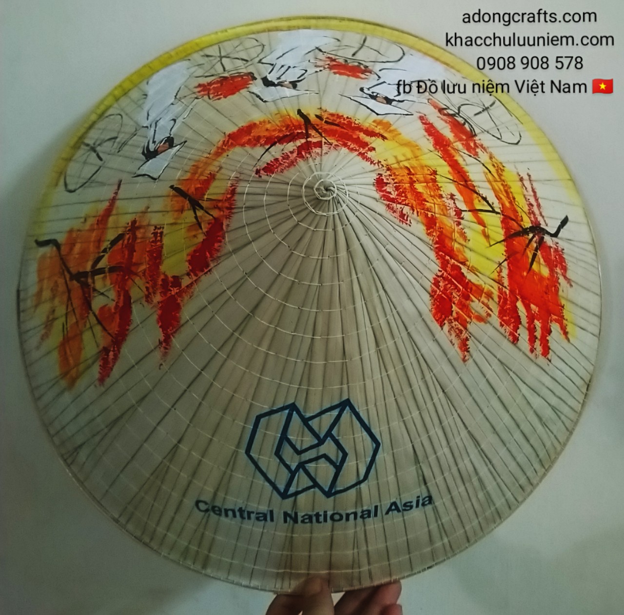 Nón lá in logo công ty và vẽ hình cô gái Việt Nam đạp xe đạp đội nón lá