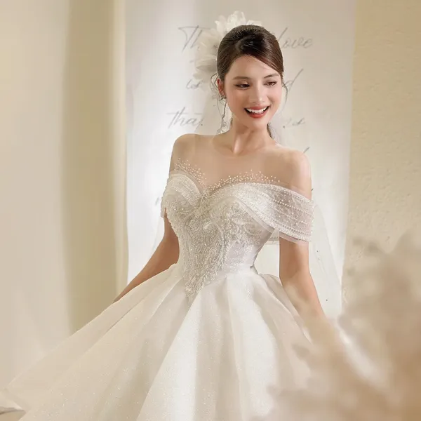 VÁY CƯỚI LÀM LỄ TRỄ VAI ĐÍNH KẾT LẤP LÁNH