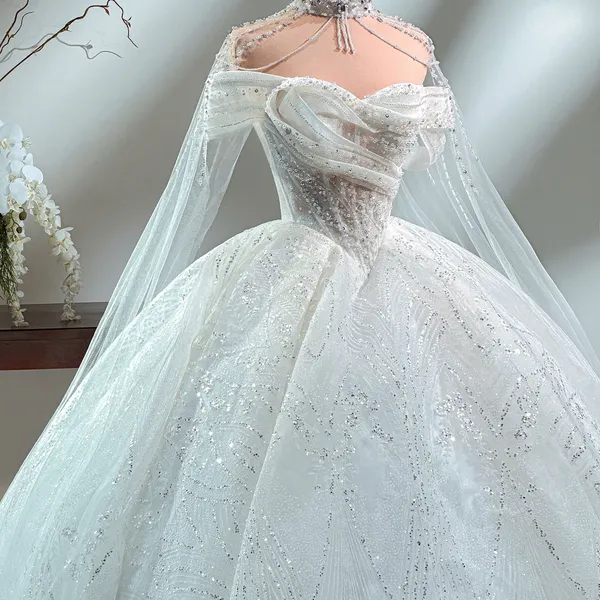 VÁY LỄ TRỄ VAI DỆT KIM SA LẤP LÁNH KÈM ÁO CHOÀNG
