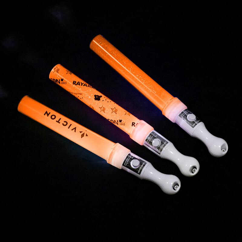 Gậy led cổ vũ kim tuyến cam 25cm Gậy led cổ vũ kim tuyến cam 25cm