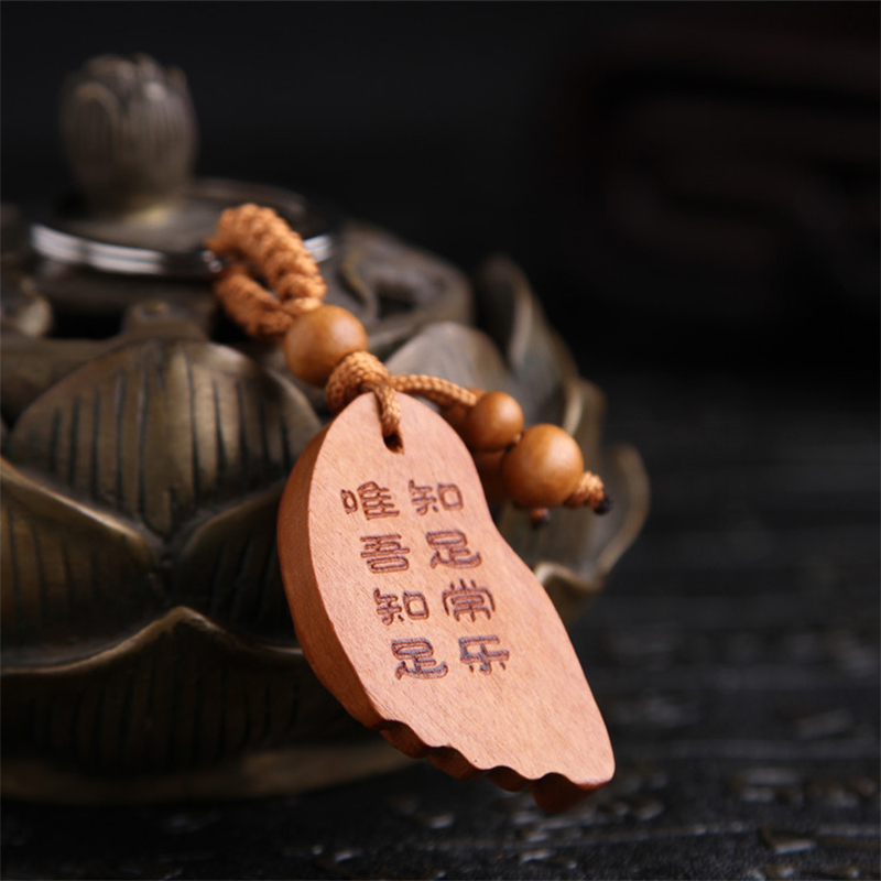 Móc khóa gỗ khắc hình bàn chân Phật Móc khóa gỗ khắc hình bàn chân Phật