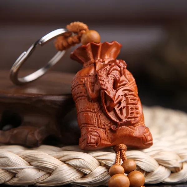 Móc khóa túi tiền khắc chữ phúc bằng gỗ