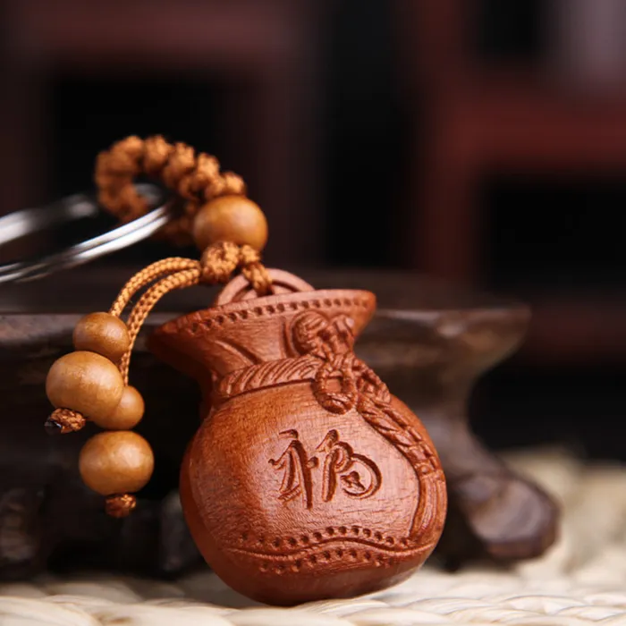 Móc khóa gỗ hình túi tiền chữ phúc