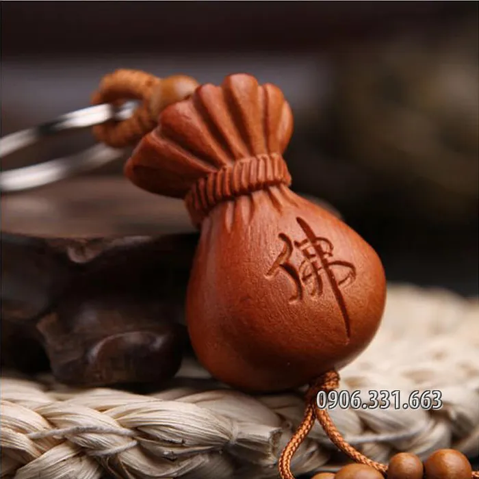Móc chìa khóa gỗ hình túi tiền