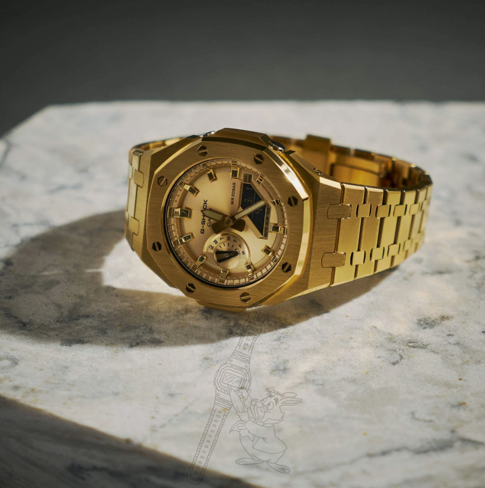 Đồng hồ G-Shock dây kim loại vàng Đồng hồ G-Shock dây kim loại vàng