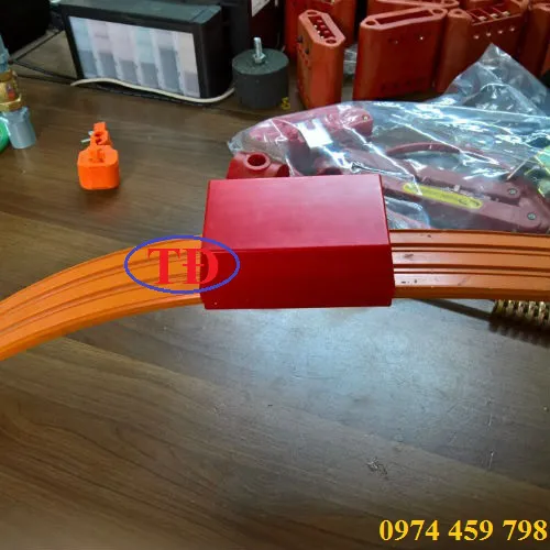Hôp ray điện an toàn cầu trục chuyên dụng