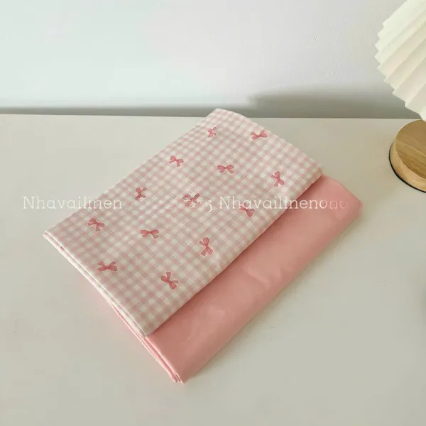 Vải cotton cao cấp hoạ tiết  caro nơ hồng