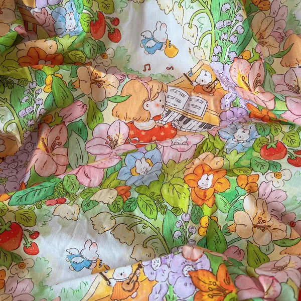 Vải Cotton hoạ tiết em bé đánh đàn