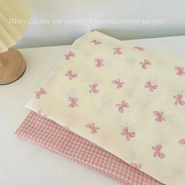 Vải cotton cao cấp hoạ tiết  nơ hồng