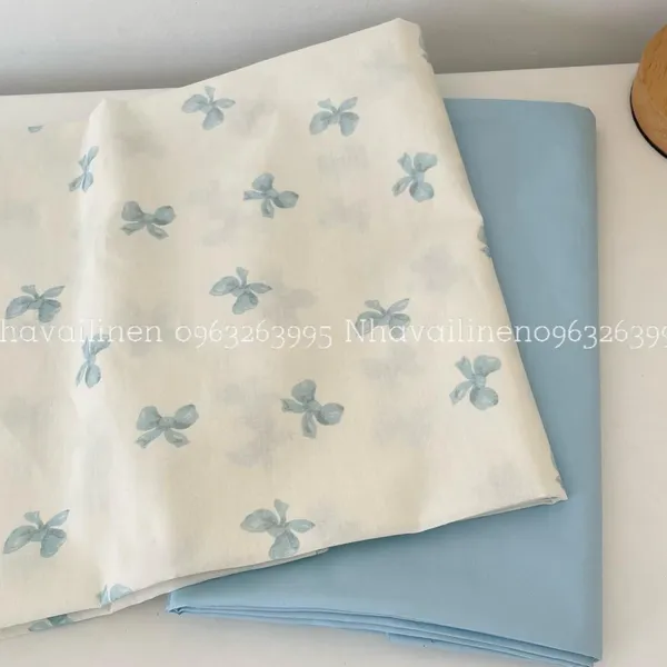 Vải cotton cao cấp hoạ tiết  nơ xanh