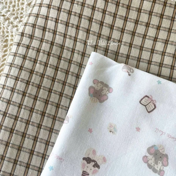 Vải cotton hoạ tiết voi sách