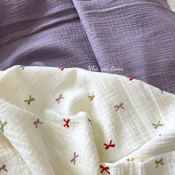 Xô muslin cao cấp 2 lớp hoạ tiết nơ ngũ sắc