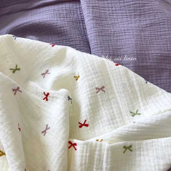 Xô muslin cao cấp 2 lớp hoạ tiết nơ ngũ sắc