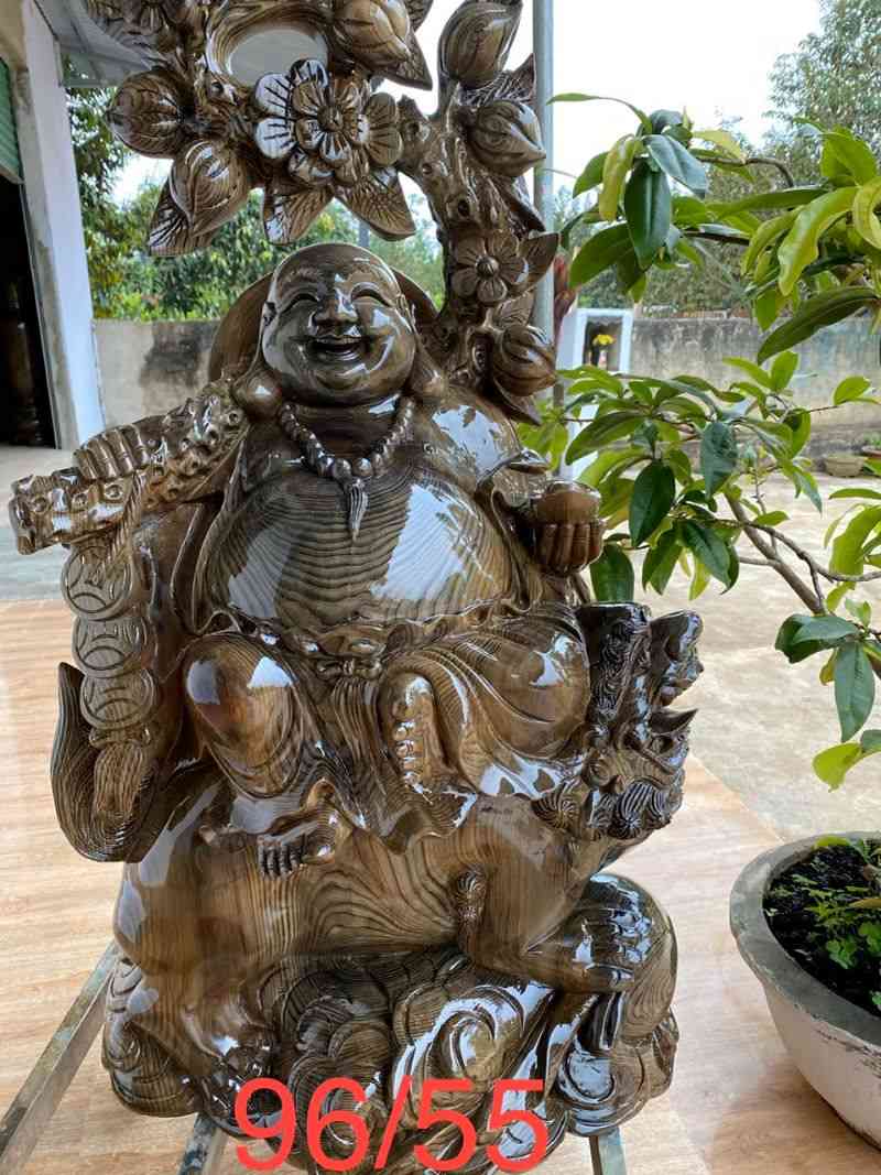 Phật di lặc cưỡi lân gỗ thủy tùng Phật di lặc cưỡi lân gỗ thủy tùng